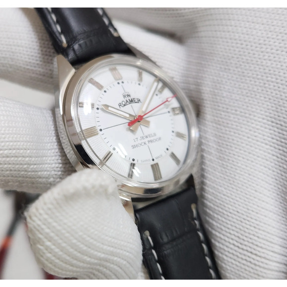 Vintage 1975 Roamer Manual Mens Silver Watch W/Leather Strap  Vintage 1975 Roamer Manual Mens Silver Watch W/Leather Strap & White accents